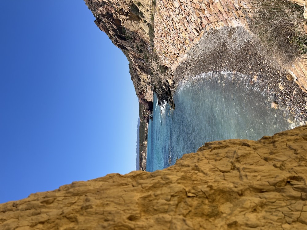Sandstone cliffs and beach at Bolnuevo